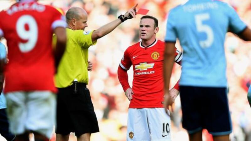 Wayne Rooney of Manchester United receives a straight red card from  referee Lee Mason after a foul on Stewart Downing of West Ham  at Old Trafford.  Photograph: Laurence Griffiths/Getty Images