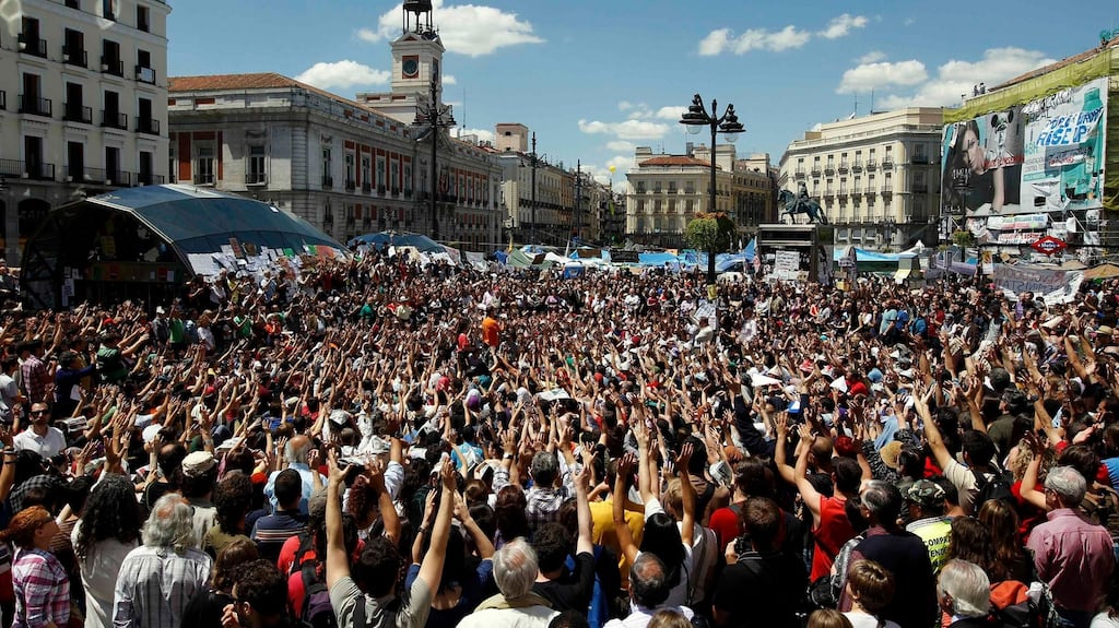 Demonstrators listen to a speaker at Madrid’s famous Puerta del Sol in May, 2011. Jon Aguirre Such got involved in organising a series of demonstrations that became “los indignados”. Photograph: Andrea Comas/Reuters