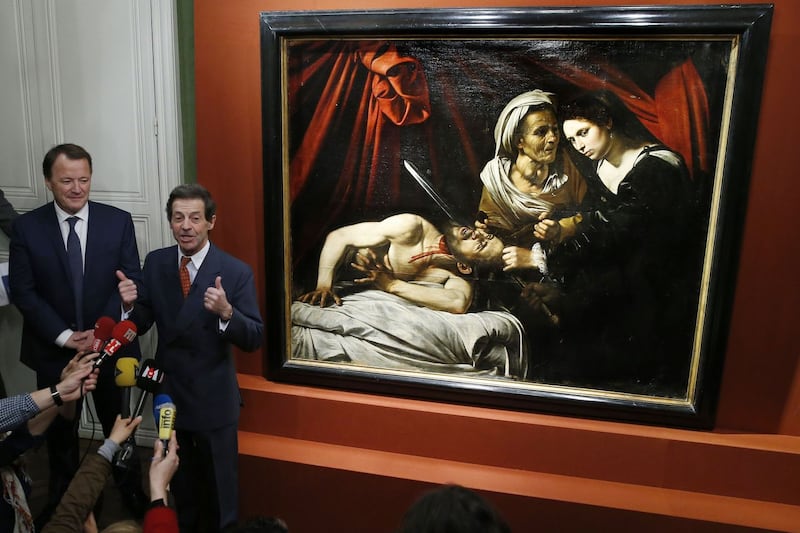 Art expert: Eric Turquin with the Toulouse Caravaggio. Photograph: Patrick Kovarik/AFP/Getty
