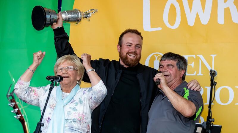 Shane Lowry joins his grandmother Emmy Scanlon and  uncle Tommy in  a song during his homecoming to Clara in Offaly on Tuesday night. Photograph:  Morgan Treacy/Inpho