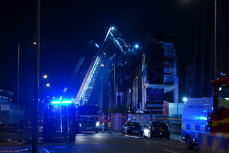 Firefighters at the scene following a fire on Fox Street in Liverpool. Photograph: Peter Byrne/PA Wire 

