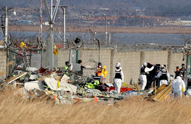 Firefighters at the wreckage of the passenger plane at Muan International Airport. Photograph: Chung Sung-Jun/Getty