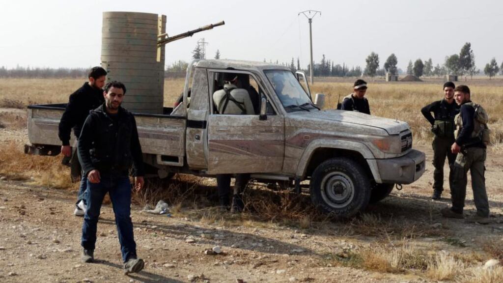 Free Syrian Army fighters near a pick-up truck mounted with an anti-aircraft weapon at al-Jarba area near the fifth bridge area on Damascus International Airport Road at the weekend. Photograph: Msallam Abd Albaset/Reuters