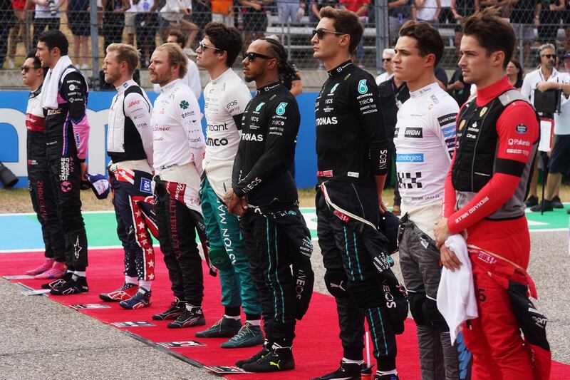 Formula One drivers Guanyu Zhou,  Esteban Ocon, Kevin Magnussen, Valtteri Bottas, Lance Stroll, Lewis Hamilton, George Russell, Lando Norris and Charles Leclerc pause in memory of Red Bull owner Dietrich Mateschitz ahead of the US Grand Prix. Photograph: Shutterstock