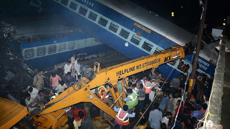 Emergency workers look for survivors on the wreckage of a train carriage after an express train derailed near the town of Khatauli in the Indian state of Uttar Pradesh on August 19, 2017. Photograph: AFP/Getty Images