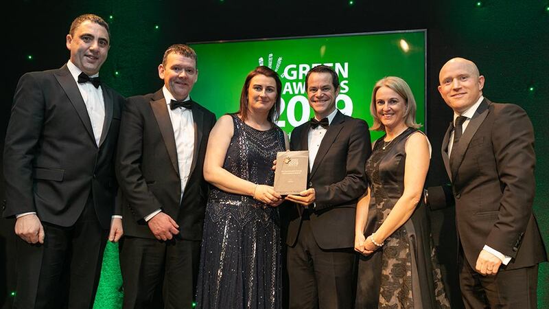 Mark Bennett, Country Manager, Talent Garden presents The Sustainable Energy Achievement Award to the AbbVie Team.