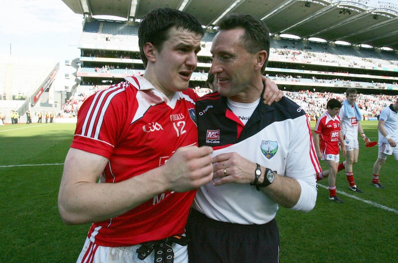 Manager Peter Fitzpatrick with Adrian Reid after Louth's All-Ireland SFC qualifier defeat to Dublin in 2010. Photograph: Donall Farmer/Inpho