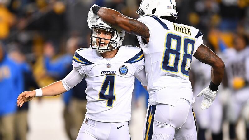 Mike Badgley and Virgil Green celebrate the game winning field goal which gave the Chargers a 33-30 win over the Pittsburgh Steelers. Photograph:  Joe Sargent/Getty