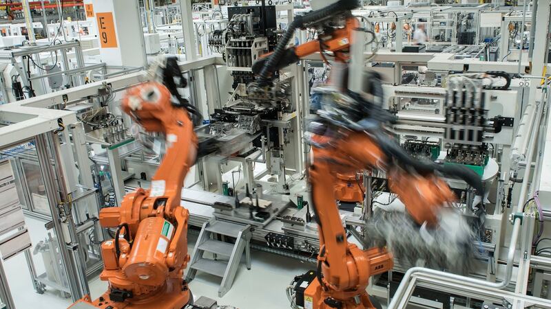 Robots assemble engines at the Volkswagen plant in Chemnitz, Germany. For now, much of the commercial action for softer robots is in logistics, replacing production-line jobs that can’t yet be handled by hard robots. Photograph: Jens Meyer/AP