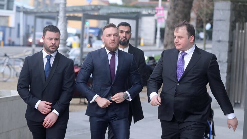 Conor McGregor (centre) arrives at Dublin District Court where he faced  motoring charges. Photograph: Niall Carson/PA Wire