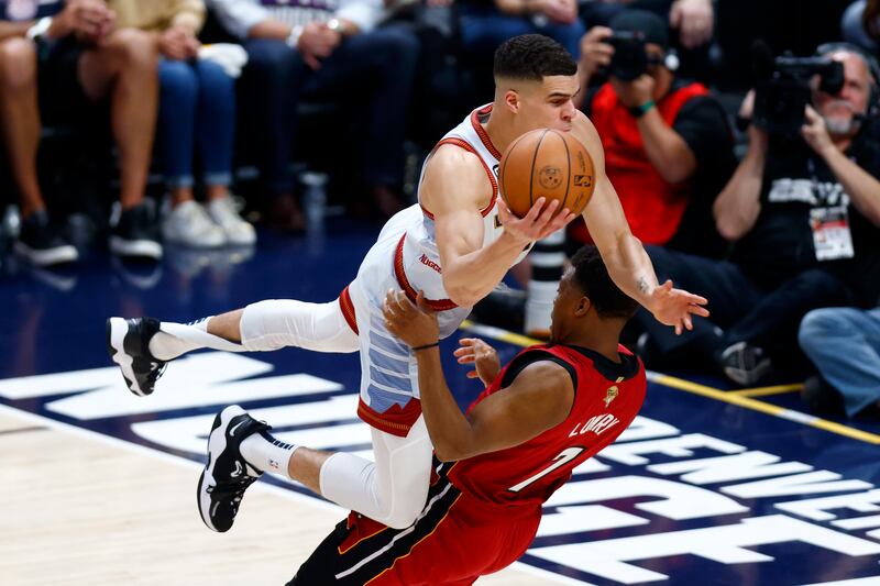 Michael Porter Jr of the Denver Nuggets drives to the basket against Kyle Lowry of the Miami Heat during the first quarter in Game Five of the 2023 NBA Finals at Ball Arena in Denver, Colorado. Photograph:  Justin Edmonds/Getty Images