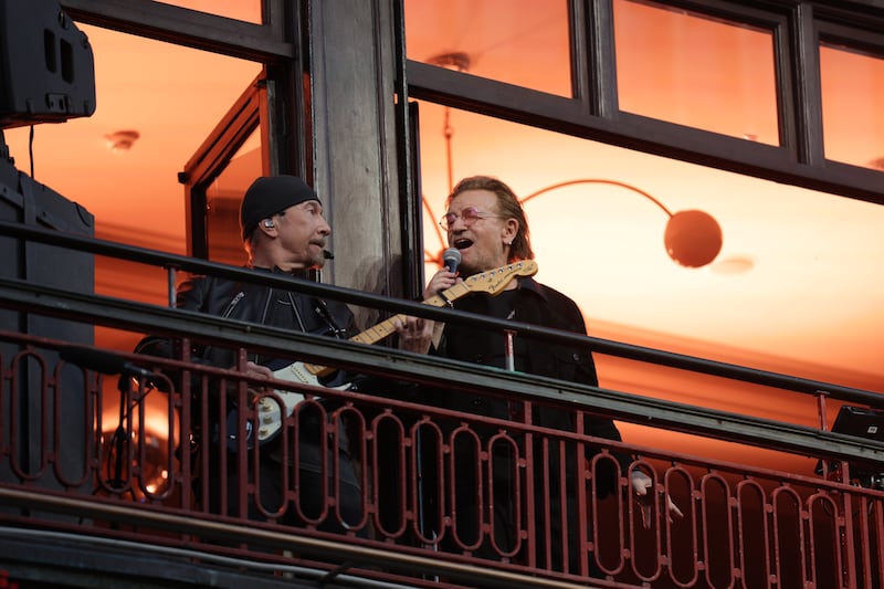 The Edge and Bono on the balcony of Bewley's, Grafton Street, on Friday evening.  Picture: Enda O'Dowd