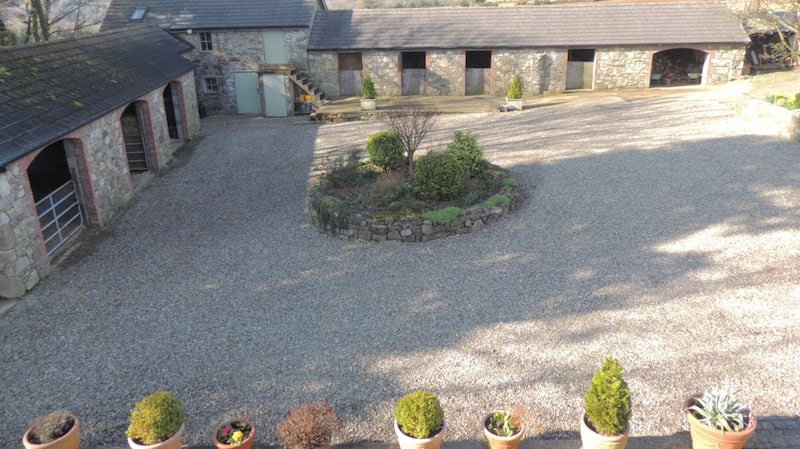 Cut stone stables in courtyard.