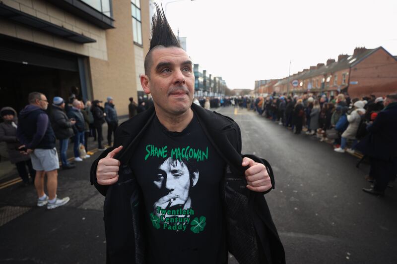 John Farrell outside Shelbourne Park Stadium waits for the funeral procession of Shane MacGowan to make its way through Dublin ahead of his funeral in Co Tipperary. Photograph: Liam McBurney/PA Wire