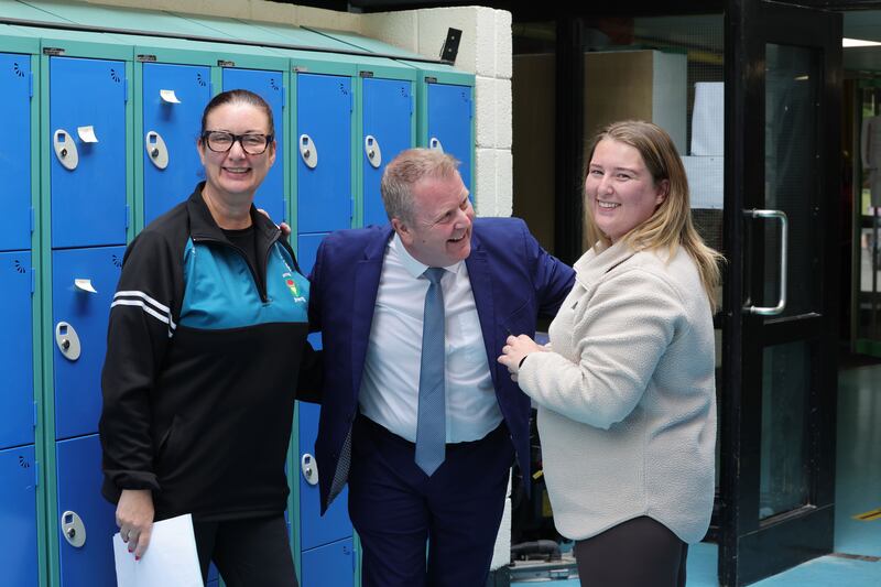 Kevin Shortall with mother and daughter Janice and Carleigh Doyle, who are also school employees and former students. Photograph: Alan Betson