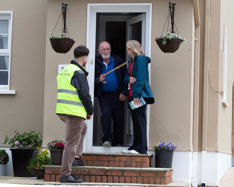 Green Party candidates Pauline O'Reilly and Adam Ó Cealaigh speak with local man Patsy Creamer while canvassing in Ballinamore, Co Leitrim. Photograph: Brian Farrell