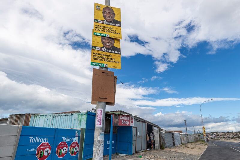 An election poster for South African president Cyril Ramaphosa looms over a coffee shop in Khayelitsha, Cape Town on April 23rd. Photograph: Nic Bothma/EPA