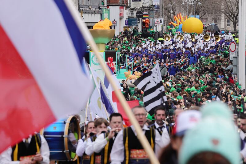 17/03/2024  - Over 4,200 street performers, pageant companies and marching bands from Ireland and across the world take to the streets of Dublin for the National St. Patrick’s Festival Parade, the biggest ever produced, with a crowd of approximately 500,000 gathered in Dublin City to watch. Photograph: Alan Betson The Irish Times Enjoying the festivities surrounding the St. Patrick’s Day parade in Dublin City.  Photograph: Alan Betson / The Irish Times

