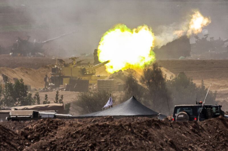 An Israeli army self-propelled howitzer fires rounds near the border with Gaza, in southern Israel. Photograph: Jack Guez/AFP via Getty Images
