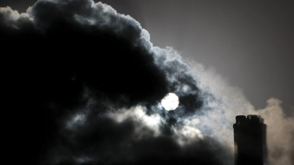 The sun is seen through emissions coming from funnels of the brown coal Loy Yang Power Station in the Latrobe Valley near Melbourne in this file photograph. Conservative Prime Minister Tony Abbott has announced cuts to Australia’s greenhouse gas emissions. Photograph: Mick Tsikas/Reuters