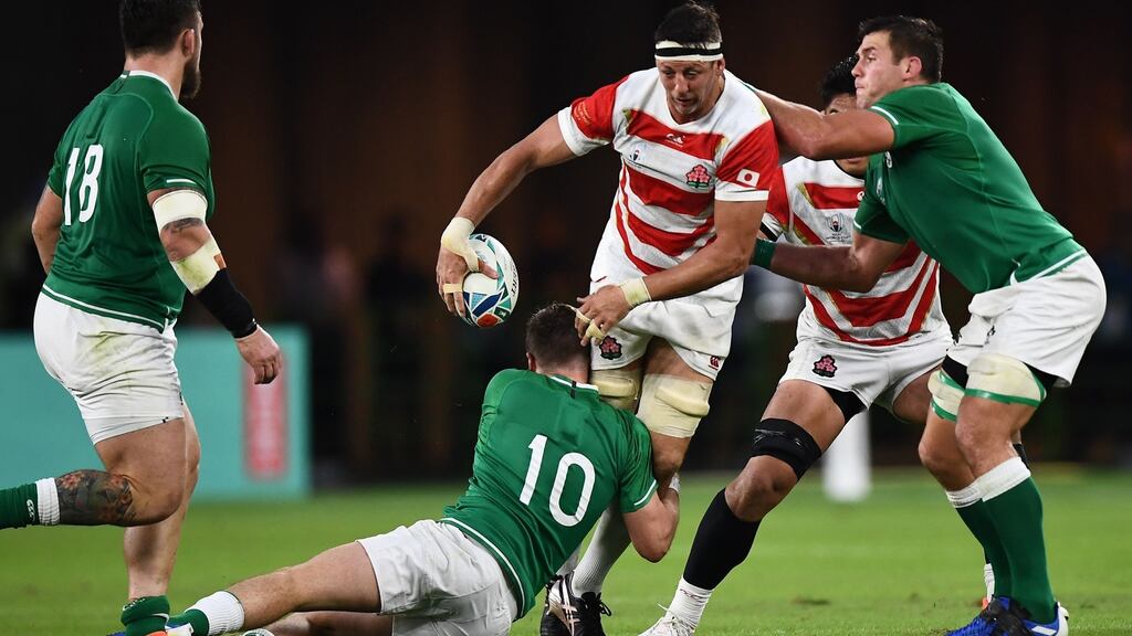 Japan lock Luke Thompson is tackled by Johnny Sexton and CJ Stander during the Rugby World Cup Pool A game at the Ecopa stadium in Shizuoka. Photograph: Anne-Christine Poujoulat/AFP/Getty Images