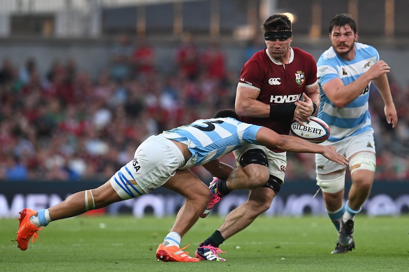 Tom Curry of Lions is tackled against Argentina. Photograph: Charles McQuillan/Getty