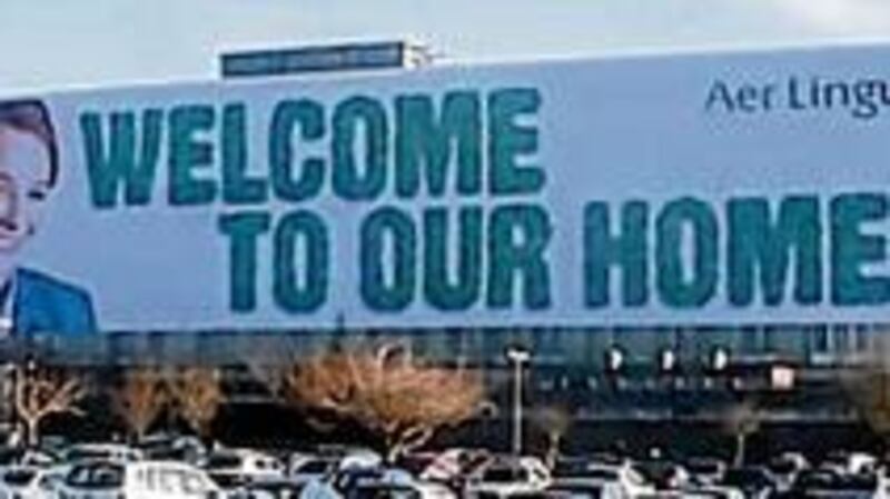Aer Lingus at Dublin airport: tarpaulin draped over head office building should act as "warm welcome to all overseas visitors" and a "friendly greeting to returning Irish residents".