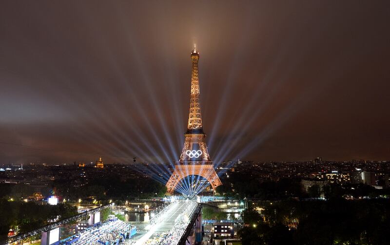 Paris 2024 Olympic Games:: Eiffel Tower and lasers lighting up the sky, Photograph: Cheng Min/AFP/Getty Images