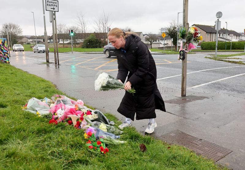Danielle McLoughlin leaves flowers at the roadside. Photograph: Alan Betson