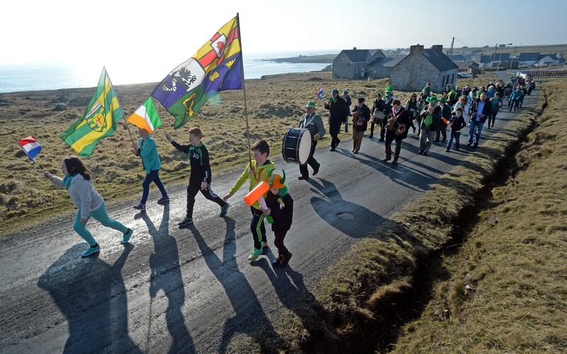 Local children lead the parade of islanders on St Patrick's Day on Tory island. Photograph: Eric Luke 