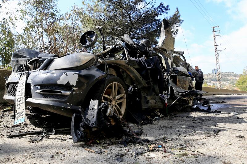 A destroyed vehicle hit by an Israeli strike that was carrying Hezbollah's Al Manar TV correspondent Ali Shoeib, Beirut-based Al Mayadeen TV reporter Fatima Ftouni, and her brother, video journalist Mohammed Ftouni, in the town of Jezzine in southern Lebanon.