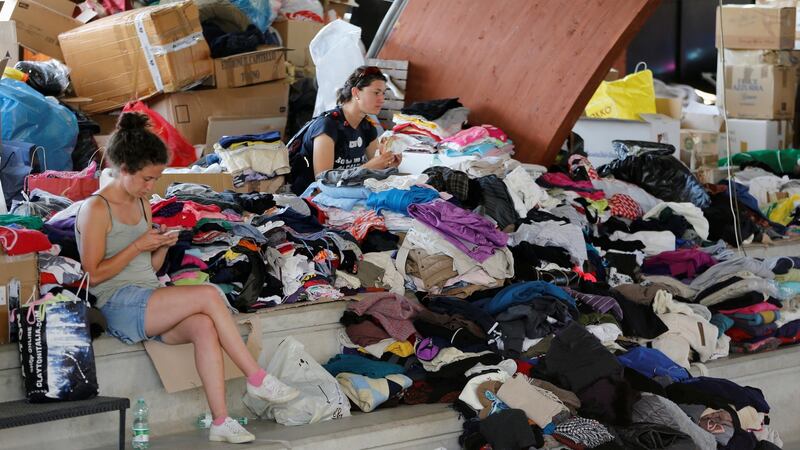Donated clothes ready  to be distributed in a gym  in Amatrice, Italy, after an earthquake there. Photograph: Ciro De Luca/Reuters