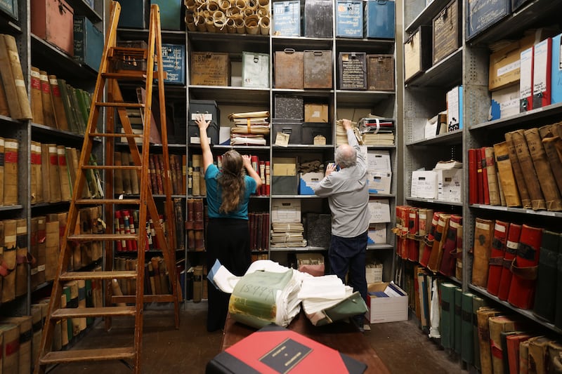 Staff of the central office of the high court in the strong room where the historic cause books and deed rolls are securely stored. Photograph: Alan Betson/The Irish Times