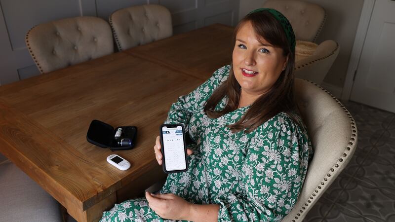 Sarah Cooke-O’Neill, who is now 14 weeks pregnant, with her glucometer which helps her monitor her diabetes. Photograph: Nick Bradshaw