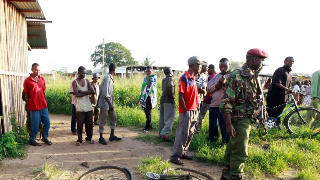 Residents gather near the scene of a massacre by unidentified gunmen in the coastal Kenyan town of Mpeketoni. Photograph: Joseph Okanga/Reuters