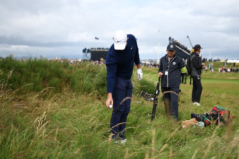 Northern Ireland's Rory McIlroy takes a penalty drop into the rough. Photograph: Henry Nicholls/Getty        