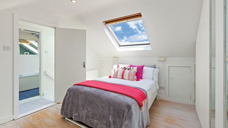 One of the three  bedrooms