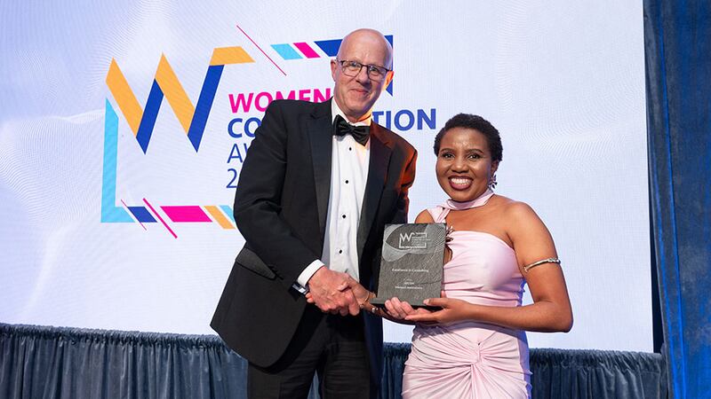 Matt Mohan, chief executive at FKM Fit Out, presents the excellence in consulting award to Malepeli Malataliana, AECOM