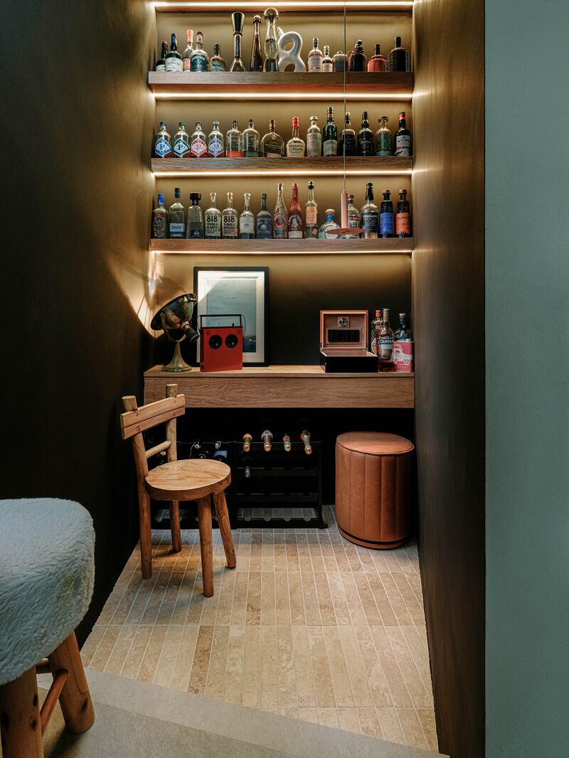 The climatically cooler pantry doubles as a home bar.  Photograph Max Fedorov