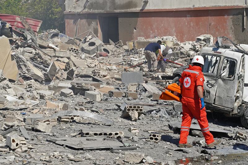 First responders pictured today at the site of an Israeli airstrike that targeted the southern Lebanese village of Habbouch. Photo by Abbas Fakih/AFP via Getty Images