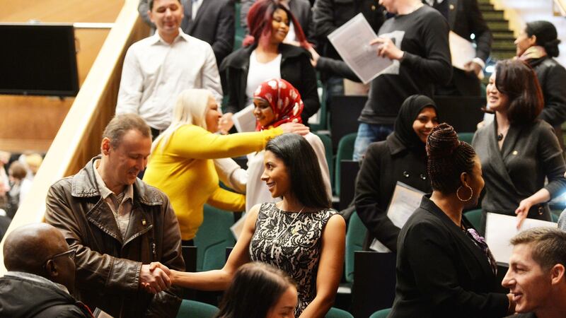 Candidates celebrate becoming  Irish citizens at  the Convention Centre in Dublin. Photograph: Alan Betson/The Irish Times