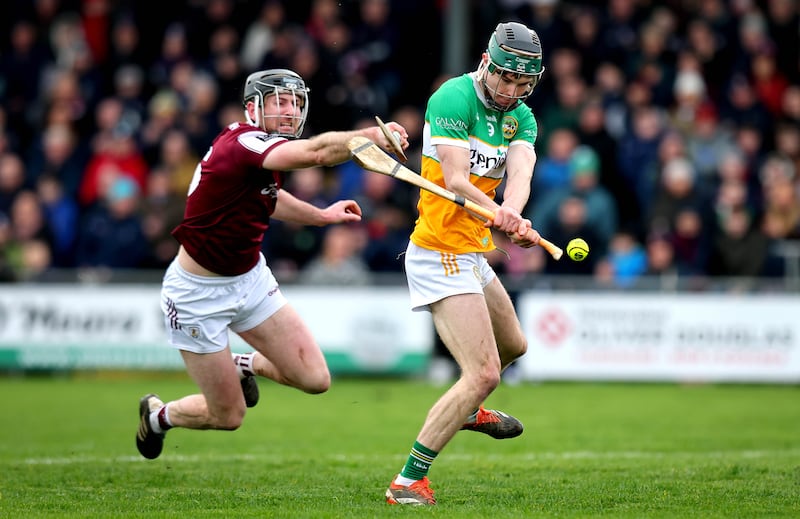 Offaly’s Ter Guinan is hooked by Galway's Padraic Mannion. Photograph: Ryan Byrne/Inpho