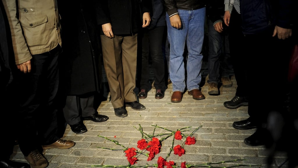 Members of the Istanbul Medical Chamber place carnations near the blast site at Sultanahmet square in Istanbul, Turkey. Photograph: Yagiz Karahan/Reuters