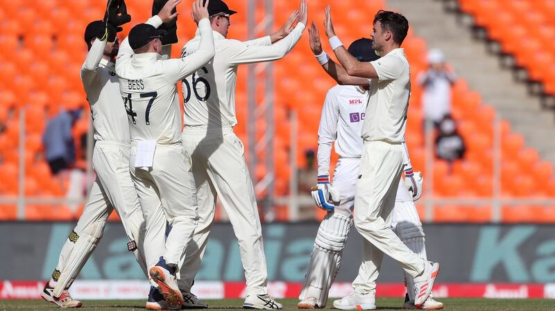 England celebrate after James Anderson takes the early wicket of  Shubman Gill. Photograph: Surjeet Yadav/Getty