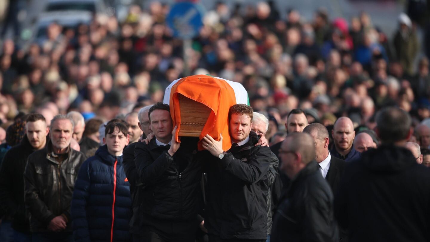 Martin McGuinness’s sons, Fiachra (l) and Emmet, carry his coffin to his home in Derry. Photograph: Niall Carson/PA Wire