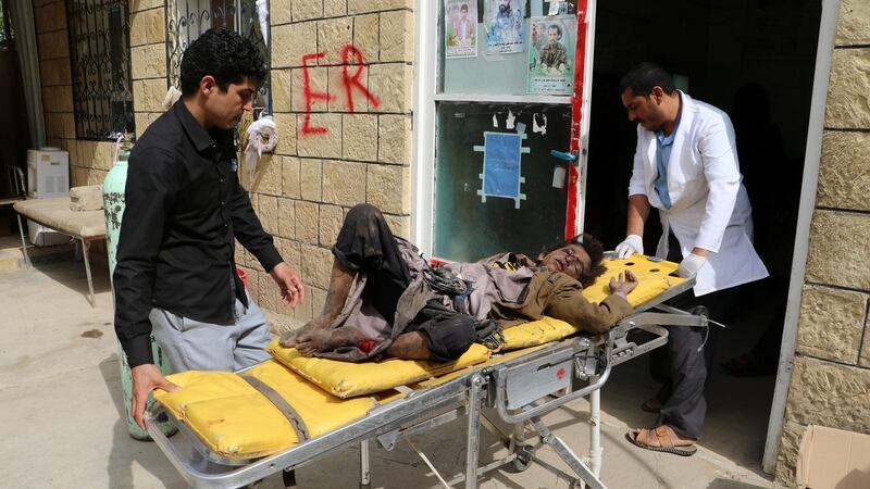 A doctor tends a boy injured by an airstrike in Sa’ada, Yemen, on Thursday. Photograph:  Naif Rahma/Reuters