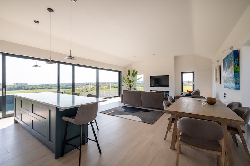 A large expanse of glass fills the room with light