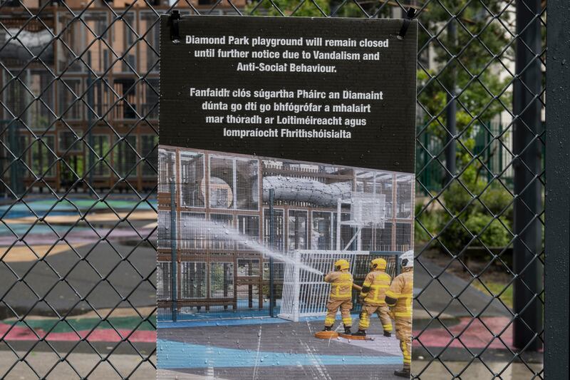 A sign placed on a fence in the park. Photograph: Paulo Nunes dos Santos