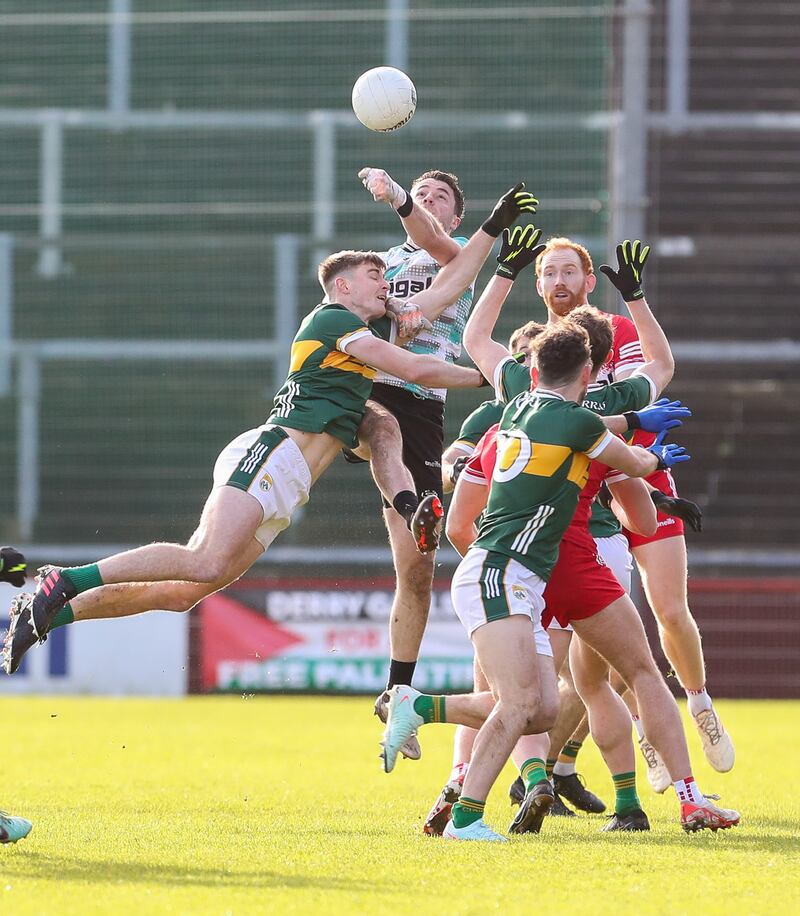Derry goalkeeper Neil McNicholl and Kerry's Diarmuid O'Connor challenge for the ball. Photograph: Lorcan Doherty/Inpho