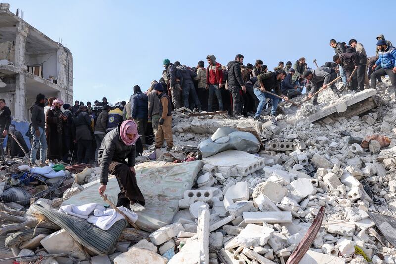 Rescuers search the rubble of buildings for casualties and survivors in the village of Besnaya in Syria's rebel-held northwestern Idlib province at the border with Turkey. Photograph: Omar Haj Kadour/AFP via Getty Images